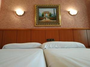 Postel nebo postele na pokoji v ubytování Hotel Real de Castilla