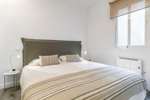 Кровать или кровати в номере Salamanca Luxury IX