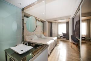 Voodi või voodid majutusasutuse Barceló Ourense toas