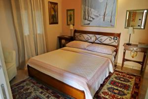 A bed or beds in a room at Locanda Bellavista