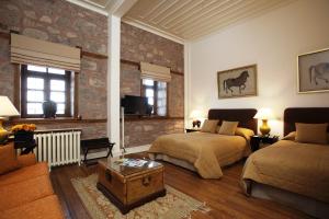 a bedroom with a large bed and a large window at Divan Cukurhan in Ankara