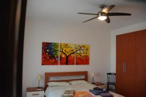 A bed or beds in a room at Casa Obini