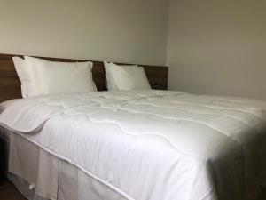 Postel nebo postele na pokoji v ubytování Hotel Matrix