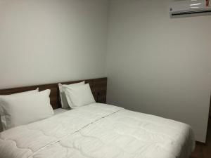 Postel nebo postele na pokoji v ubytování Hotel Matrix
