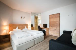 Voodi või voodid majutusasutuse Hotel Heini toas