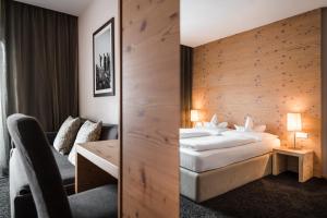 Voodi või voodid majutusasutuse Hotel Heini toas