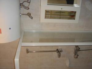 Kúpeľňa v ubytovaní Janó Apartman