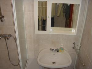 Kúpeľňa v ubytovaní Janó Apartman
