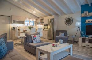 a living room with a couch and a table at Leonidas House in Parga