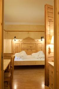Кровать или кровати в номере Piccolohotel Tempele Garni