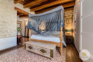 Llit o llits en una habitació de Hotel Boutique Argantonio