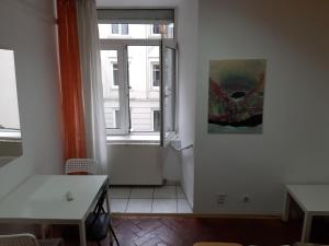 a room with a table and a window at Art Hostel in Lviv