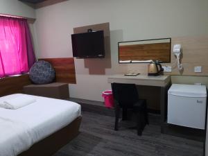 Postel nebo postele na pokoji v ubytování Qing yun resthouse Bandar, Brunei Darussalam