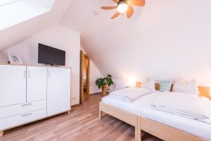 Łóżko lub łóżka w pokoju w obiekcie Winzer Suite - Weingut Dietl