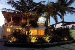 Um jardim em Pousada Villa Maritima