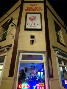 a building with a sign above a door at The Fox in Bristol