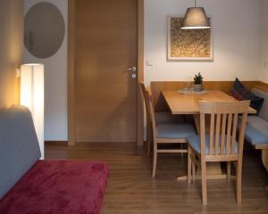 a dining room with a table and chairs at Apartments Domino in Campo Tures