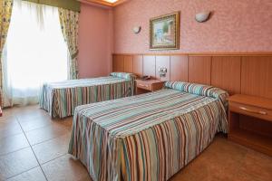 Postel nebo postele na pokoji v ubytování Hotel Real de Castilla