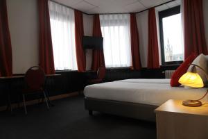 Postel nebo postele na pokoji v ubytování Hotel De Spiegel + 36 fotografií