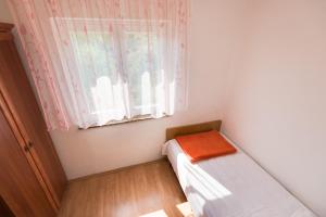Postel nebo postele na pokoji v ubytování Apartments Kronja