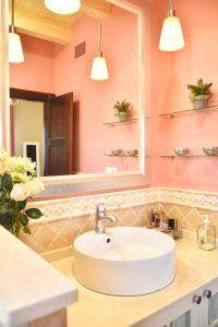 a bathroom with a sink and a mirror at Villa Miranda in El Rompido