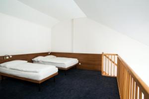 Postel nebo postele na pokoji v ubytování Club Hotel am Kreischberg
