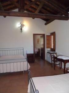 Posteľ alebo postele v izbe v ubytovaní Etna Wine Azienda Agrituristica