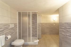 a bathroom with a toilet and a shower at Casa Leonardo in Casamicciola Terme +14 photos