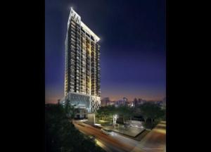 a rendering of a tall building at night at Luxury Apartment near Downtown (Pick-up Service) in Bangkok