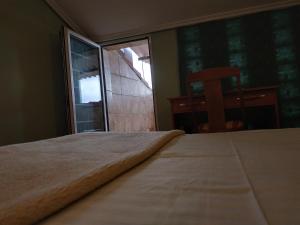Postel nebo postele na pokoji v ubytování Hotel Real de Castilla