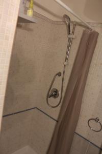 a shower in a bathroom with a shower curtain at Casa Azzurra in Castellammare del Golfo