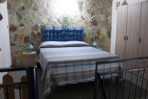 Posteľ alebo postele v izbe v ubytovaní Casa Azzurra