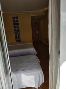Postel nebo postele na pokoji v ubytování Hotel Real de Castilla