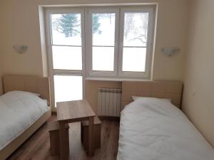 Posteľ alebo postele v izbe v ubytovaní Willa RYŚ