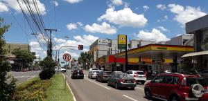 a busy city street with cars parked on the road at HOTEL MARIANI in Lajeado