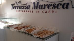 a bakery with a sign that reads keratectreatednesota institute of agriculture in at Relais Maresca Luxury Small Hotel & Terrace Restaurant in Capri