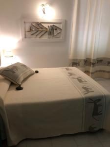 Postel nebo postele na pokoji v ubytování Hotel Canne al Vento