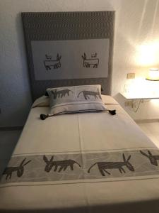 Postel nebo postele na pokoji v ubytování Hotel Canne al Vento