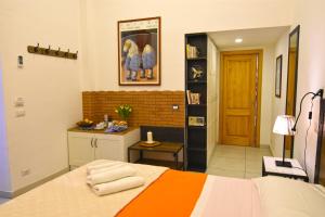 Postel nebo postele na pokoji v ubytování B&B Ninarella Napoli