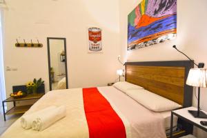 Postel nebo postele na pokoji v ubytování B&B Ninarella Napoli