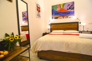 Postel nebo postele na pokoji v ubytování B&B Ninarella Napoli
