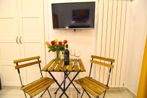 TV a/nebo společenská místnost v ubytování B&B Ninarella Napoli