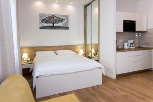 Posteľ alebo postele v izbe v ubytovaní Lugo Apartments