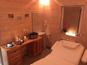 a bathroom with a toilet and a sink and a mirror at Noclegi Styrnol & SPA in Zawoja