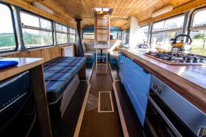 
A kitchen or kitchenette at Ceridwen Glamping, double decker bus and Yurts
