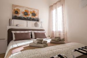 Llit o llits en una habitació de Apartment Ariento Suite