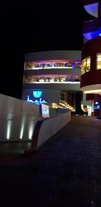 a lit up building at night with at Hotel Amala in Mexico City