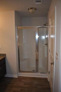 a bathroom with a shower with a glass door at Atlanta Townhome in Atlanta