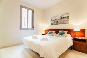 Postel nebo postele na pokoji v ubytování Buen Suceso Las Setas centro Sevilla