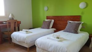 Postel nebo postele na pokoji v ubytování Logis Hôtel Restaurant Le Mas de Mon Père
